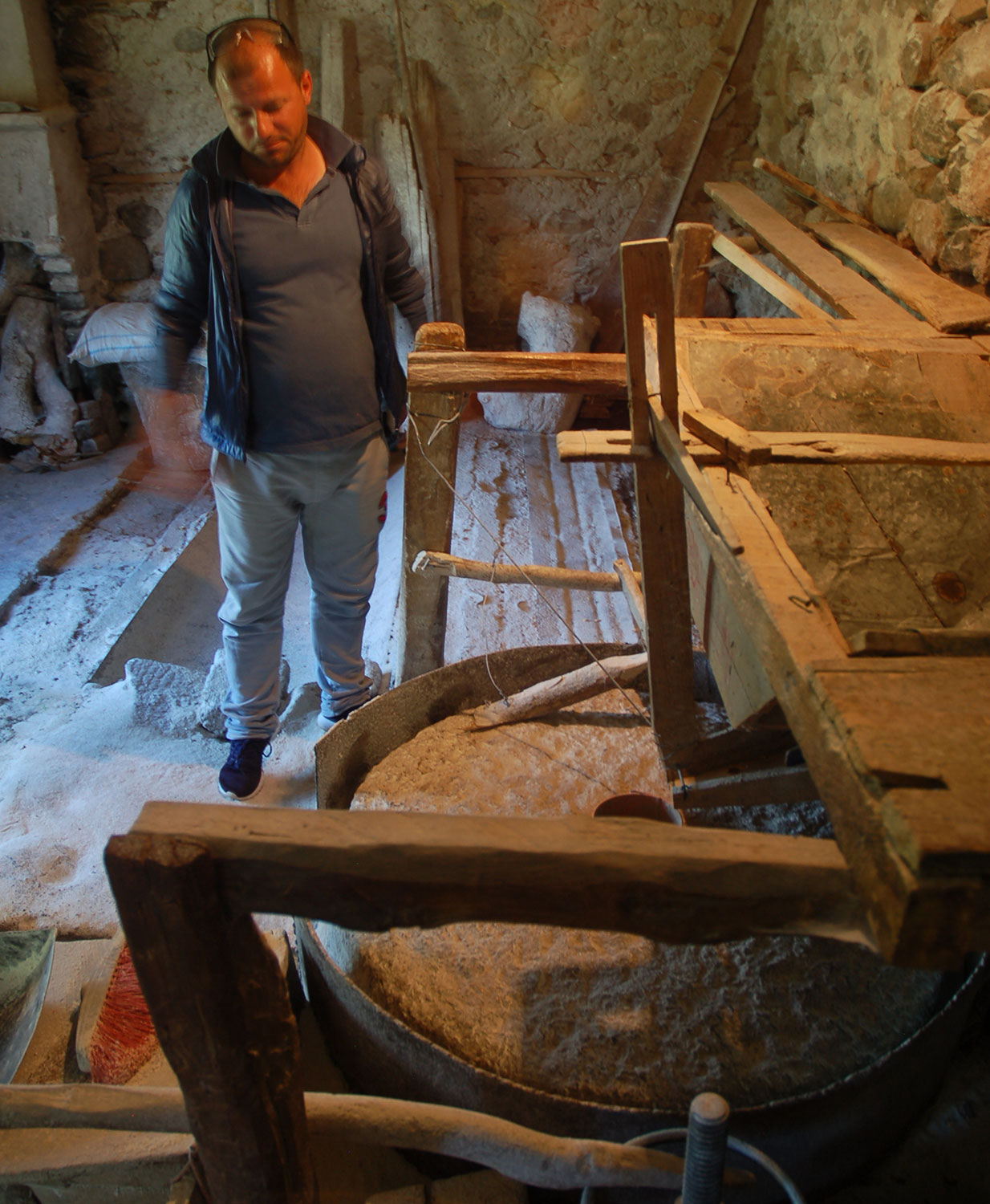 One of Xhevahir’s sons standing next to the millstone that has become useless. © Bankwatch